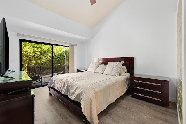 bedroom featuring ceiling fan, high vaulted ceiling, and hardwood / wood-style flooring