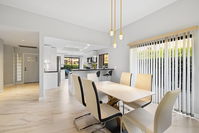 dining room featuring a tray ceiling