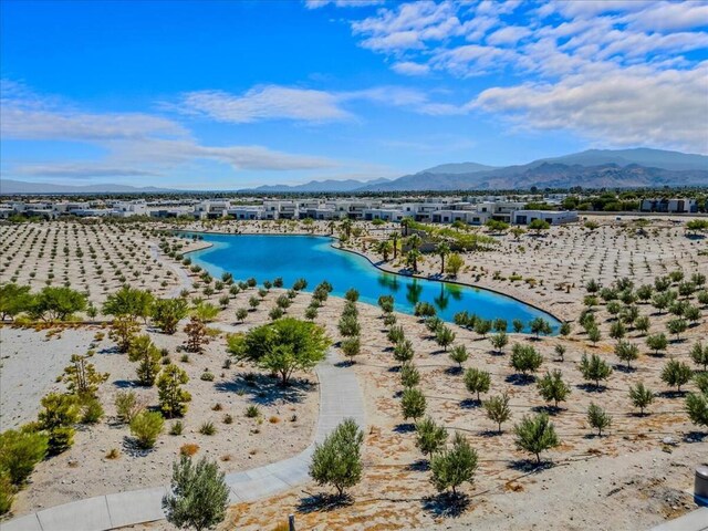 bird's eye view with a water and mountain view