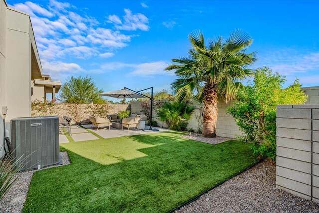 view of yard featuring outdoor lounge area, cooling unit, and a patio area