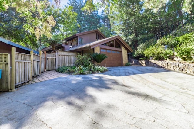 view of side of home with a garage