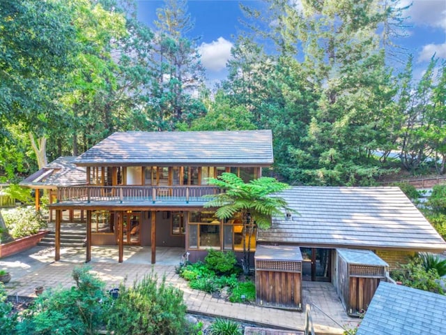 view of front of property featuring a patio and a deck