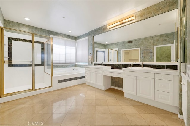 bathroom with independent shower and bath and vanity