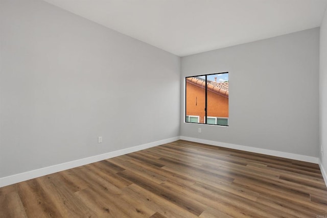 spare room featuring hardwood / wood-style floors