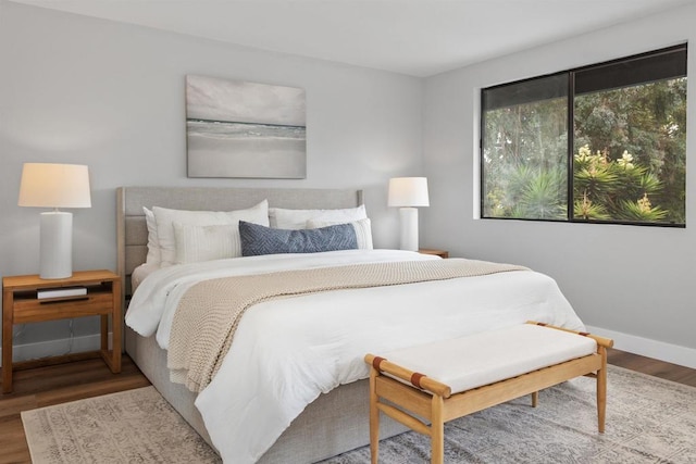 bedroom with hardwood / wood-style floors