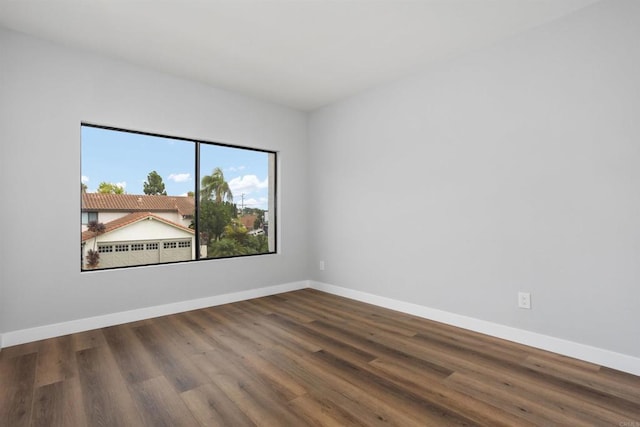 empty room featuring hardwood / wood-style flooring