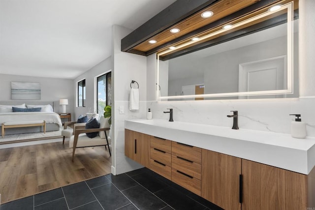 bathroom with hardwood / wood-style floors and vanity