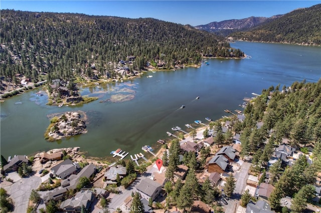 aerial view featuring a water and mountain view