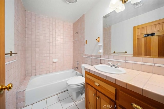 23610 W Lancaster Rd, Lancaster, CA 93536 - full bath with shower / tub combination, tile patterned flooring, vanity, toilet, and tile walls
