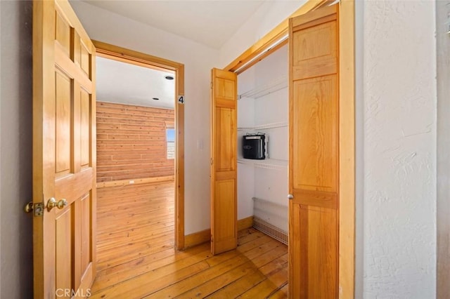 23610 W Lancaster Rd, Lancaster, CA 93536 - hall featuring wooden walls, baseboards, and light wood-style floors