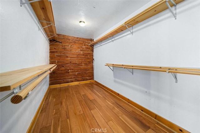23610 W Lancaster Rd, Lancaster, CA 93536 - walk in closet featuring wood-type flooring