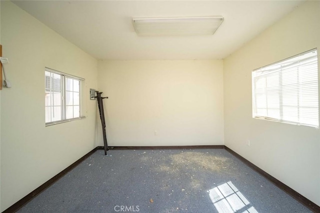 23610 W Lancaster Rd, Lancaster, CA 93536 - spare room featuring baseboards and a wealth of natural light