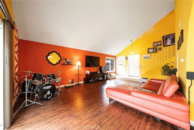 living room featuring hardwood / wood-style floors and high vaulted ceiling