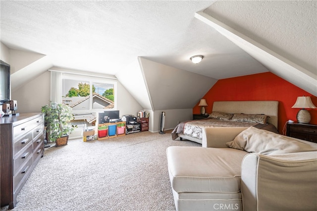 bedroom featuring carpet floors, a textured ceiling, and lofted ceiling