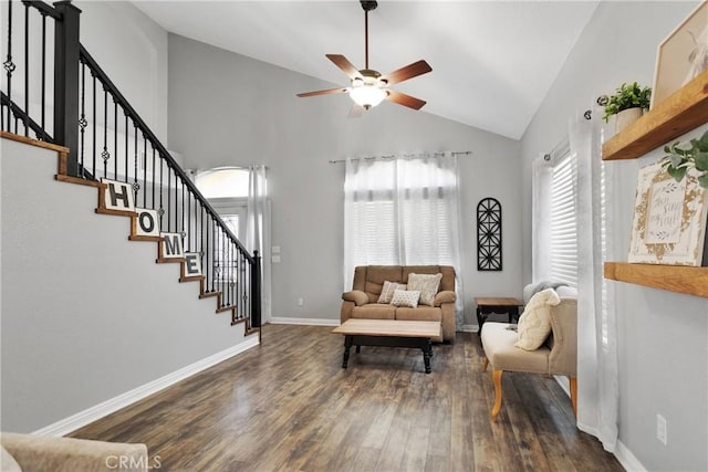 living room featuring ceiling fan, dark hardwood / wood-style flooring, and high vaulted ceiling