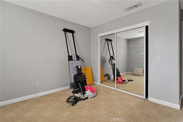 workout area with carpet floors