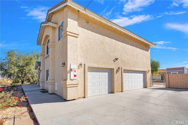 view of side of property featuring a garage