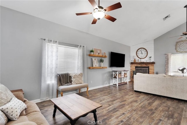 living room featuring high vaulted ceiling, dark hardwood / wood-style floors, a healthy amount of sunlight, and ceiling fan