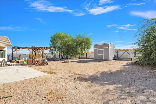 view of yard featuring a pergola, a patio, and a storage unit