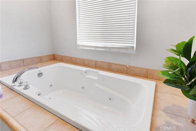 bathroom featuring tile patterned floors and a bathtub