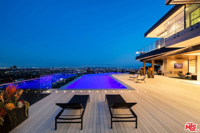 view of pool at night