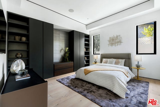 bedroom with light hardwood / wood-style flooring