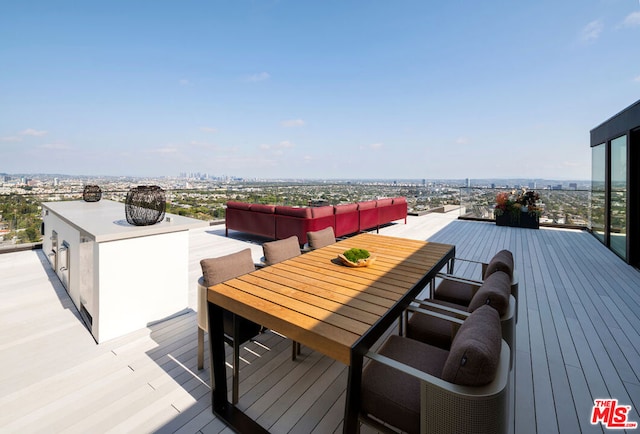 deck featuring outdoor lounge area