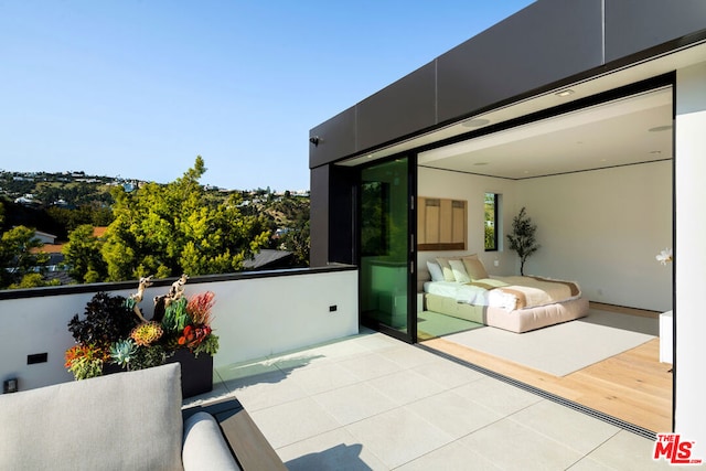 view of patio with a balcony