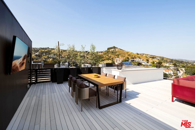 wooden deck with a mountain view