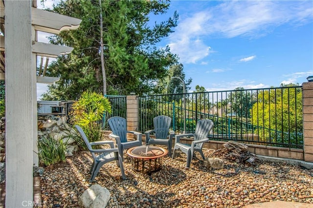 view of patio featuring an outdoor fire pit