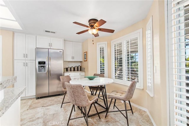 dining area with ceiling fan