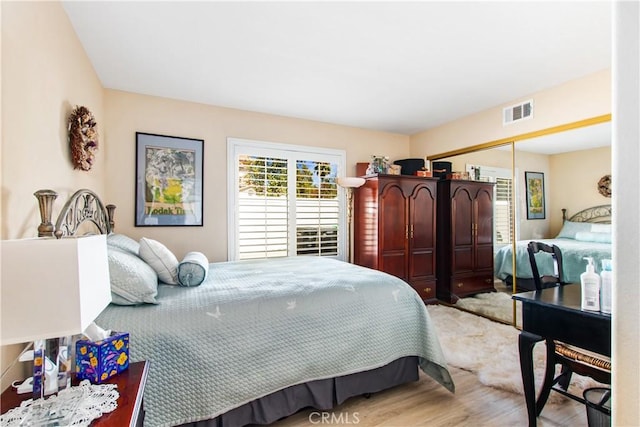 bedroom featuring light hardwood / wood-style flooring and a closet