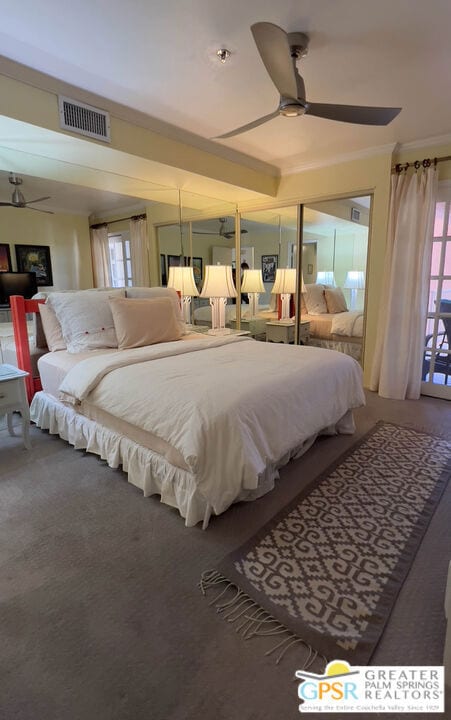 bedroom featuring ceiling fan, carpet flooring, and ornamental molding