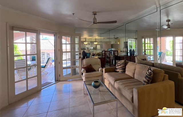 tiled living room with ceiling fan and ornamental molding