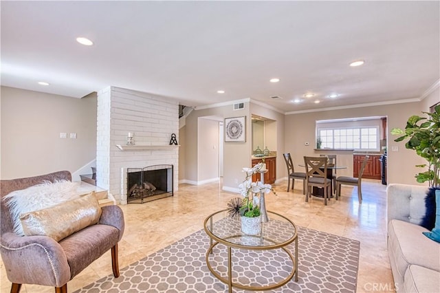 living room featuring crown molding and a brick fireplace