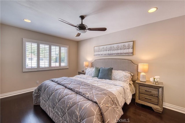 bedroom with ceiling fan and dark hardwood / wood-style flooring