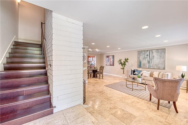 living room with ornamental molding