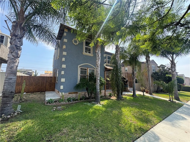 view of front of property with a front lawn