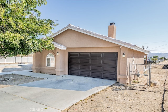 ranch-style home with a garage