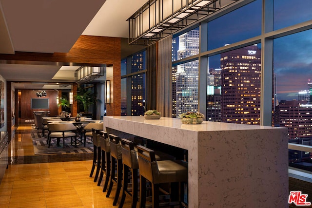 bar featuring stone countertops