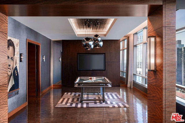 dining space with a tray ceiling