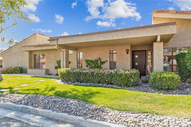 exterior space with a front yard