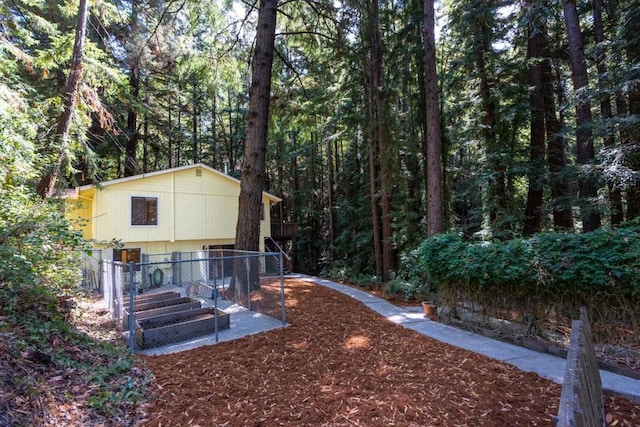 rear view of house featuring a wooden deck