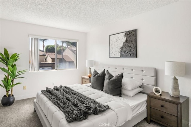 bedroom with carpet flooring and a textured ceiling