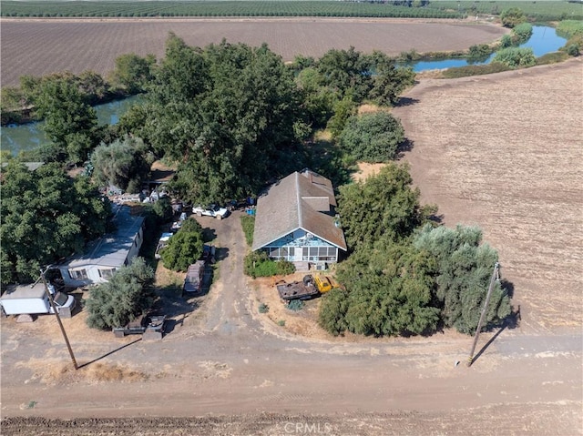 drone / aerial view featuring a rural view and a water view