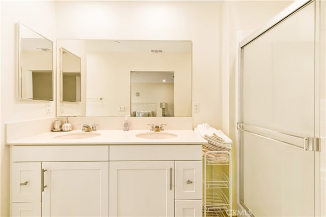 bathroom with vanity and an enclosed shower