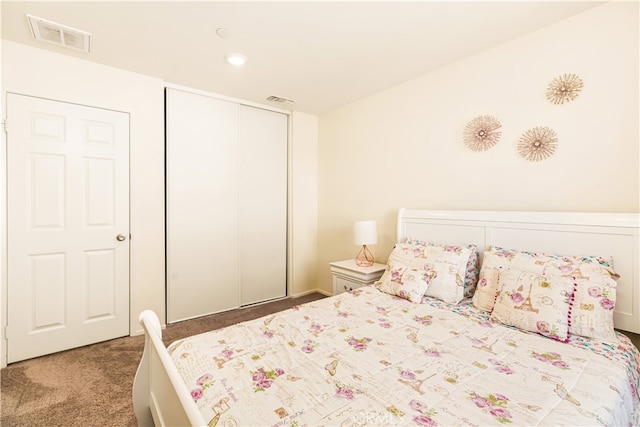 carpeted bedroom with a closet