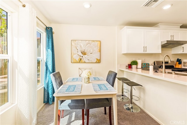 dining area with light carpet