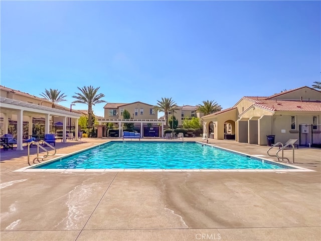 view of swimming pool featuring a patio area