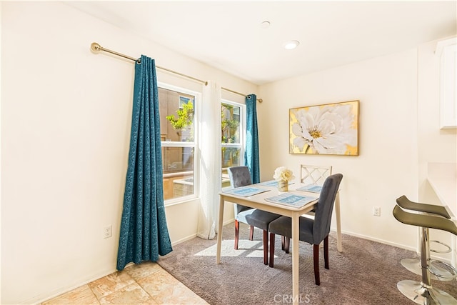 dining space featuring carpet flooring